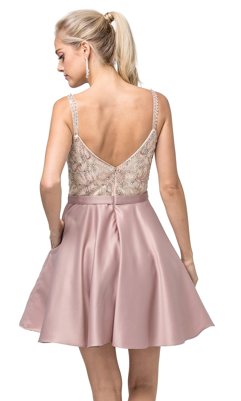 Woman wearing the Embellished-Bodice Short Homecoming Dress 3125—a pink sleeveless dress with a beaded lace bodice and flared satin skirt—stands with her back to the camera, hair in a ponytail.